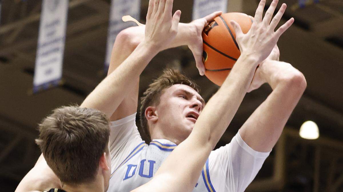 Duke’s Cooper Flagg (2) drives to the basket as Army’s Tate Laczkowski (32) defends during the first half of Duke’s game against Army at Cameron Indoor Stadium in Durham, N.C., Friday, Nov. 8, 2024.