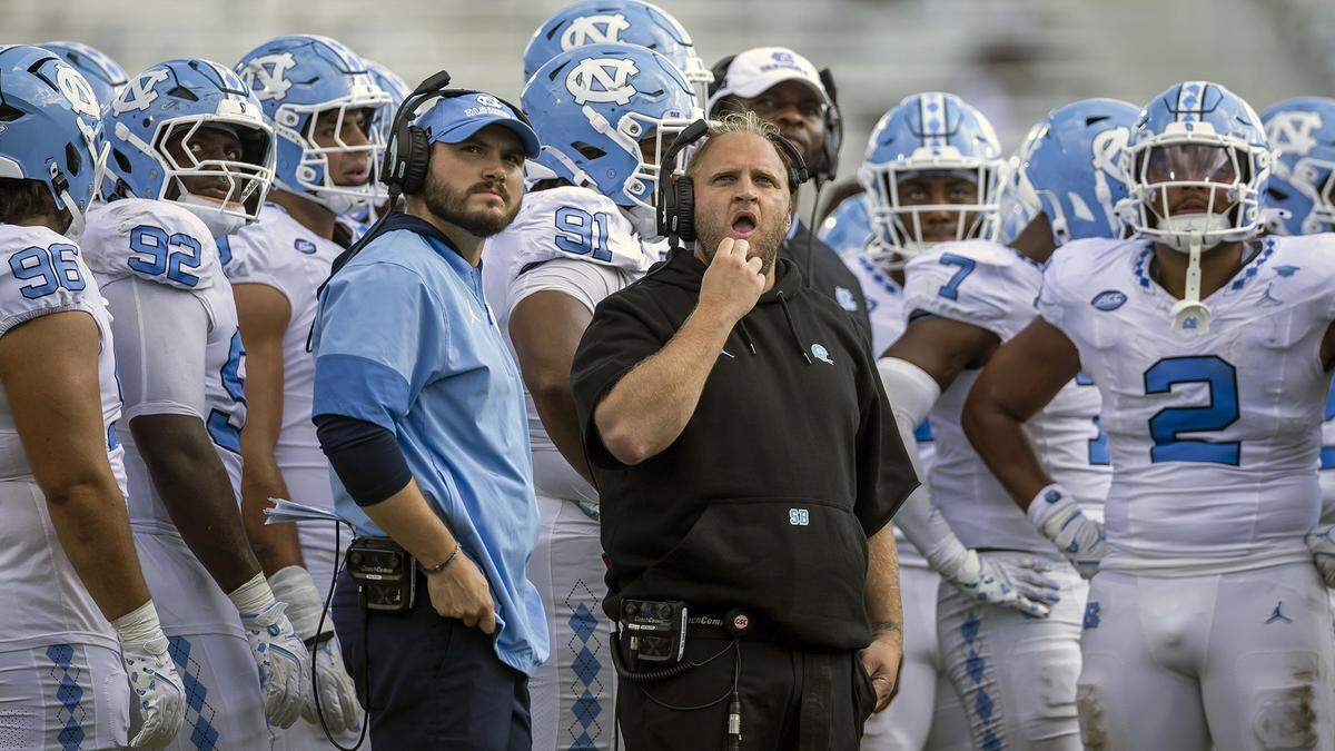 Down 13-0 in the second quarter to the University of Central Florida, North Carolina defensive coordinator Steve Belichick studies a replay on the scoreboard during a time-out on Saturday, September 20, 2025 at Acrisure Bounce House Stadium in Orlando, Fla.