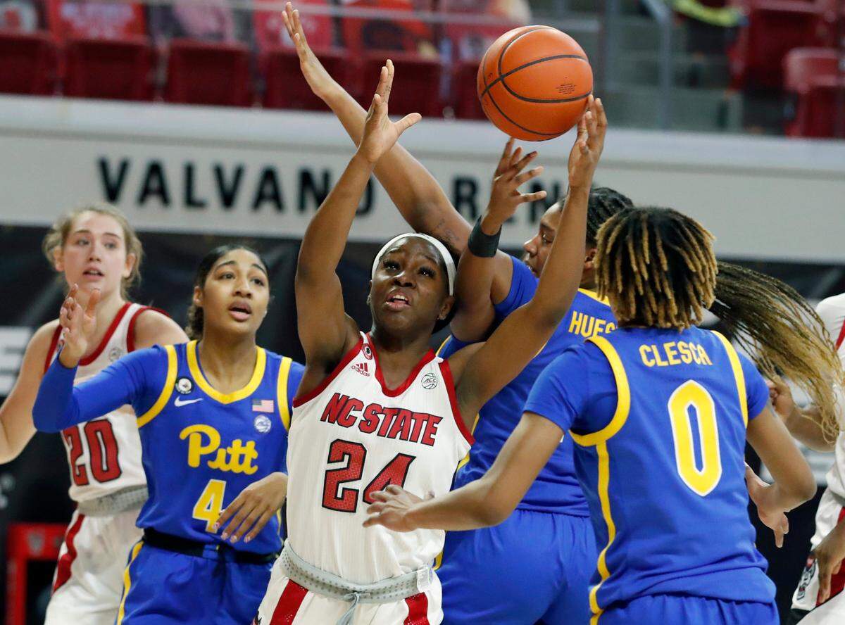 N.C. State’s Dontavia Waggoner (24) works to pull in the rebound during the second half of N.C. State’s 83-53 victory over Pittsburgh at Reynolds Coliseum in Raleigh, N.C., Thursday, February 25, 2021.