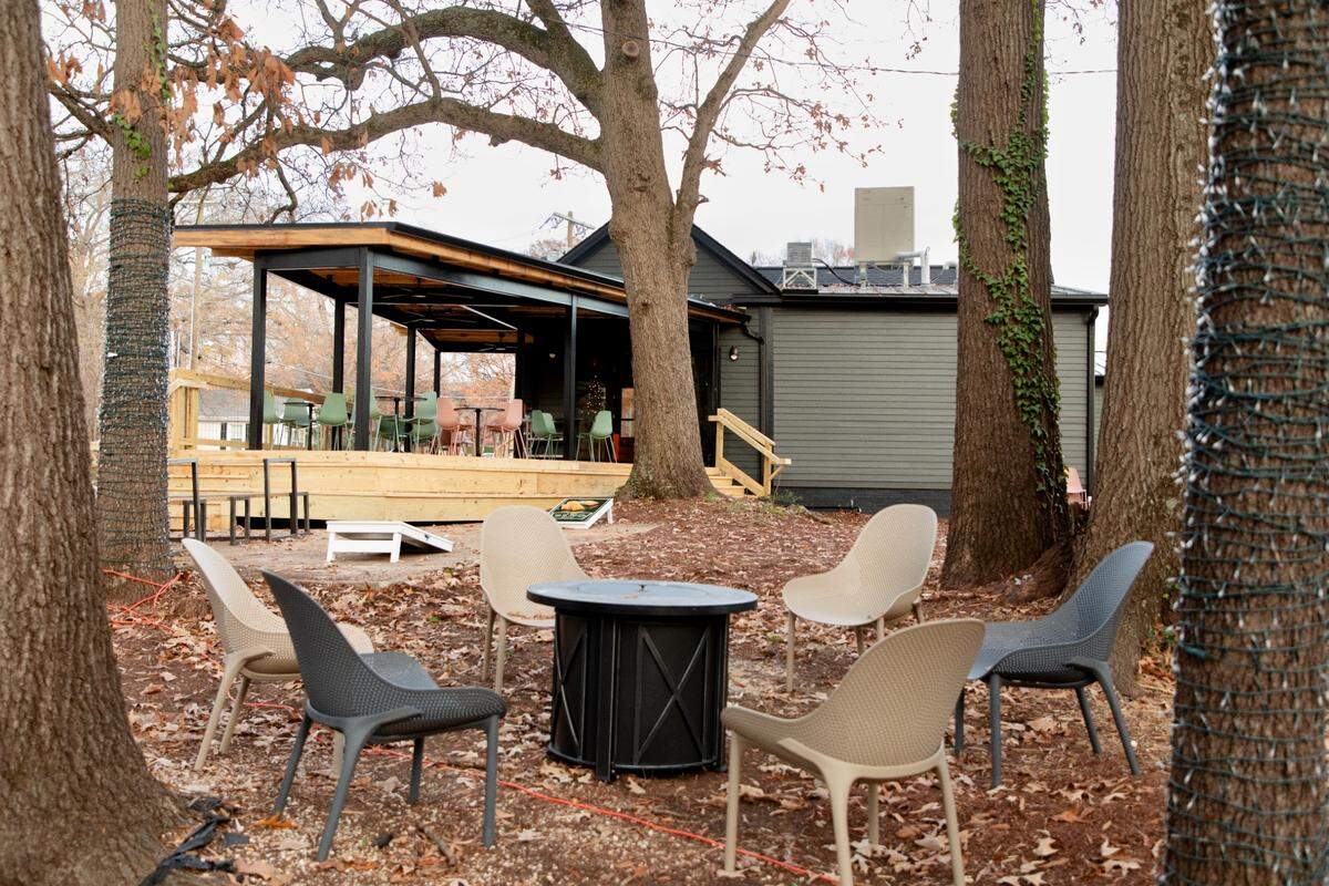The Bend Bar features a large back yard that backs up to the train tracks and offers a view of downtown Raleigh.