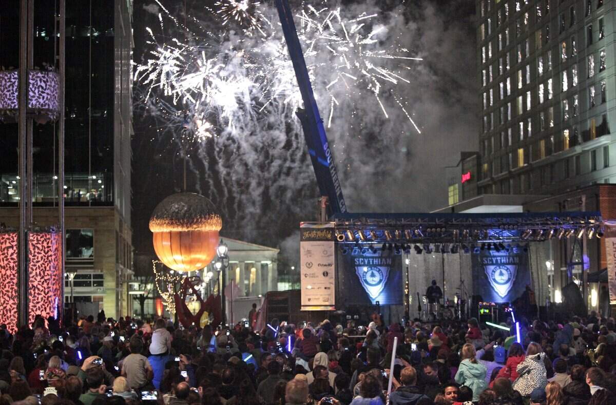 First Night Raleigh 2016 7pm acorn drop for families with children was lit with fireworks promptly as the ball dropped at 7pm on the plaza on Fayetteville Street Thursday evening, December 31, 2015. Thousands of families with kids came out for the countdown, good music and fireworks and weren’t disappointed as Thursday’s rains let up late afternoon just in time for a dry First Night Raleigh 2016 celebration in downtown Raleigh, NC.