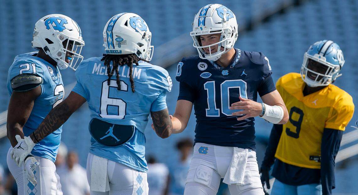 North Carolina quarterback Drake Maye (10) congratulates wide receiver Nate McCollum (6) after a pass reception for a touchdown during the Tar Heels’ spring football game on Saturday, April 15, 2023 at Kenan Stadium in Chapel Hill, N.C