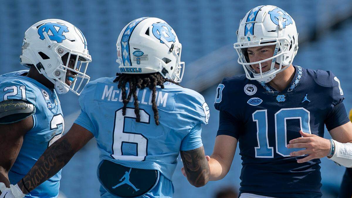 North Carolina quarterback Drake Maye (10) congratulates wide receiver Nate McCollum (6) after a pass reception for a touchdown during the Tar Heels’ spring football game on Saturday, April 15, 2023 at Kenan Stadium in Chapel Hill, N.C