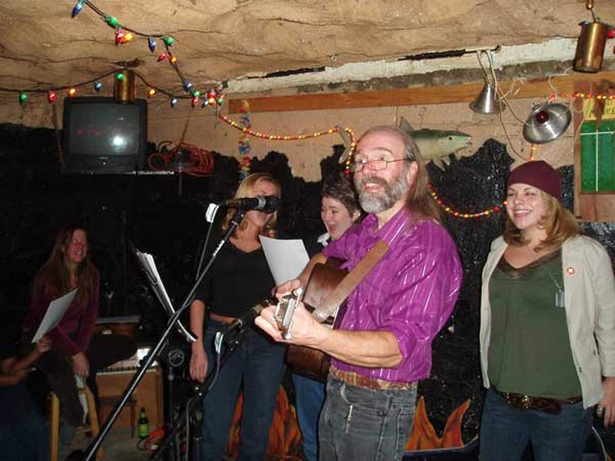 Jim Watson, known for his Christmas shows at The Cave in Chapel Hill, performs in 2005.