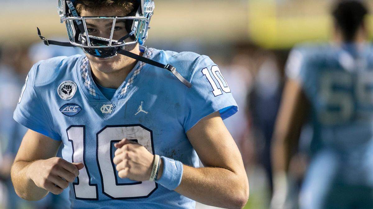 North Carolina quarterback Drake Maye (10) leaves the field following the Tar Heels’ 30-27 loss to N.C.State on Friday, November 25, 2022 at Kenan Stadium in Chapel Hill, N.C.