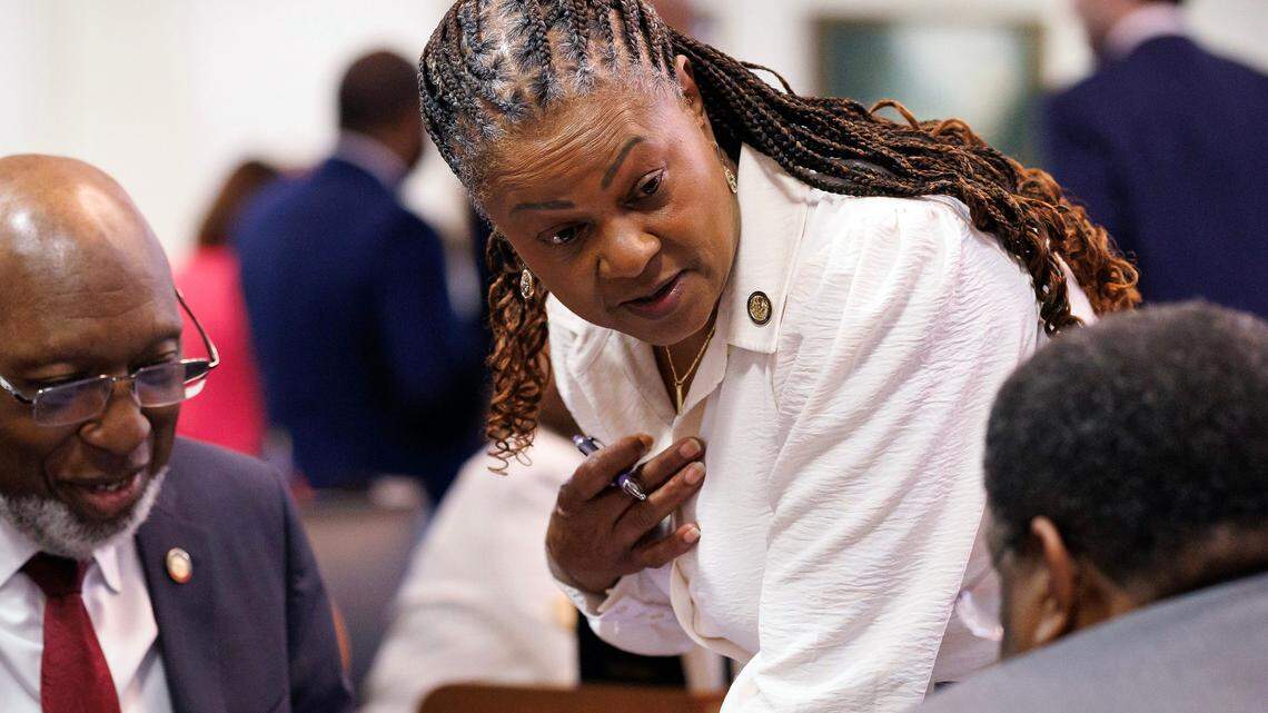 Reps. Shelly Willingham, Carla Cunningham and Garland Pierce talk during a break in session in the House chamber of the Legislative Building on Wednesday, May 21, 2025, in Raleigh, N.C.