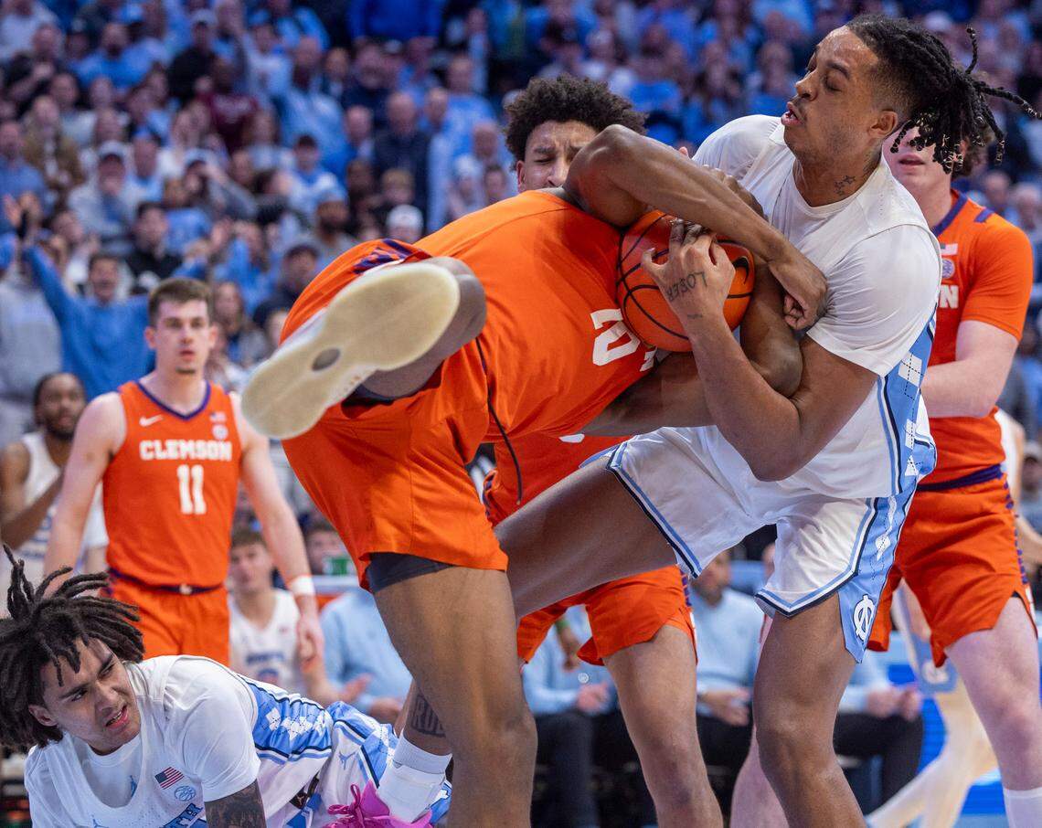 North Carolina’s Armando Bacot (5) gets tangled with Clemson’s R.J. Godfrey (10) as they battle for a rebound in the second half on Tuesday, February 6, 2024 at the Dean E. Smith Center in Chapel Hill, N.C.
