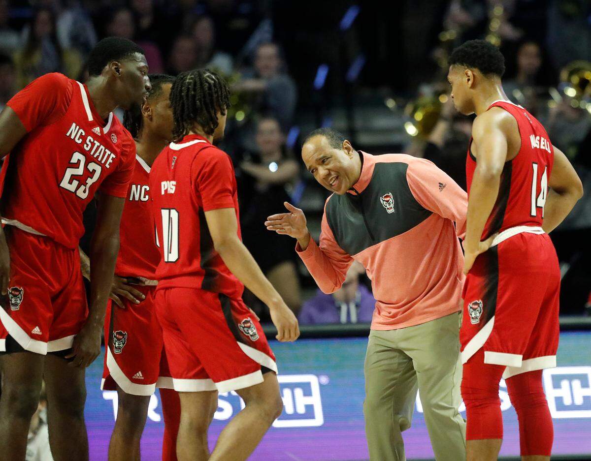 N.C. State head coach Kevin Keatts speaks with his team during the first half of the Wolfpack’s game against Wake Forest on Saturday, Feb. 10, 2024, at Lawrence Joel Veterans Memorial Coliseum in Winston-Salem, N.C.