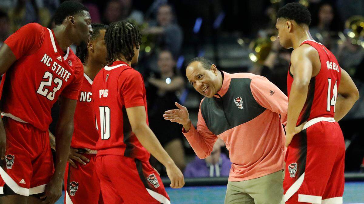 N.C. State head coach Kevin Keatts speaks with his team during the first half of the Wolfpack’s game against Wake Forest on Saturday, Feb. 10, 2024, at Lawrence Joel Veterans Memorial Coliseum in Winston-Salem, N.C.