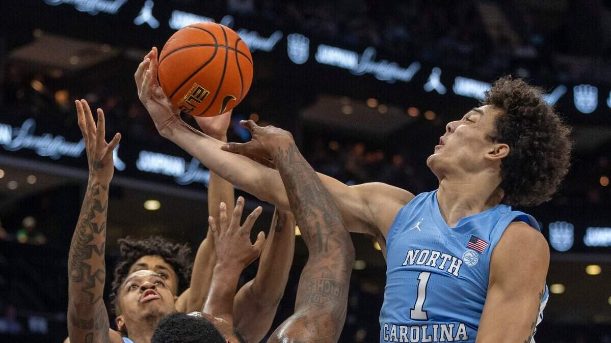 North Carolina’s Zayden High (1) controls an offensive rebound over Oklahoma’s Otega Oweh (3) in the first half on Wednesday, December 20, 2023 at the Spectrum Center in Charlotte, N.C.