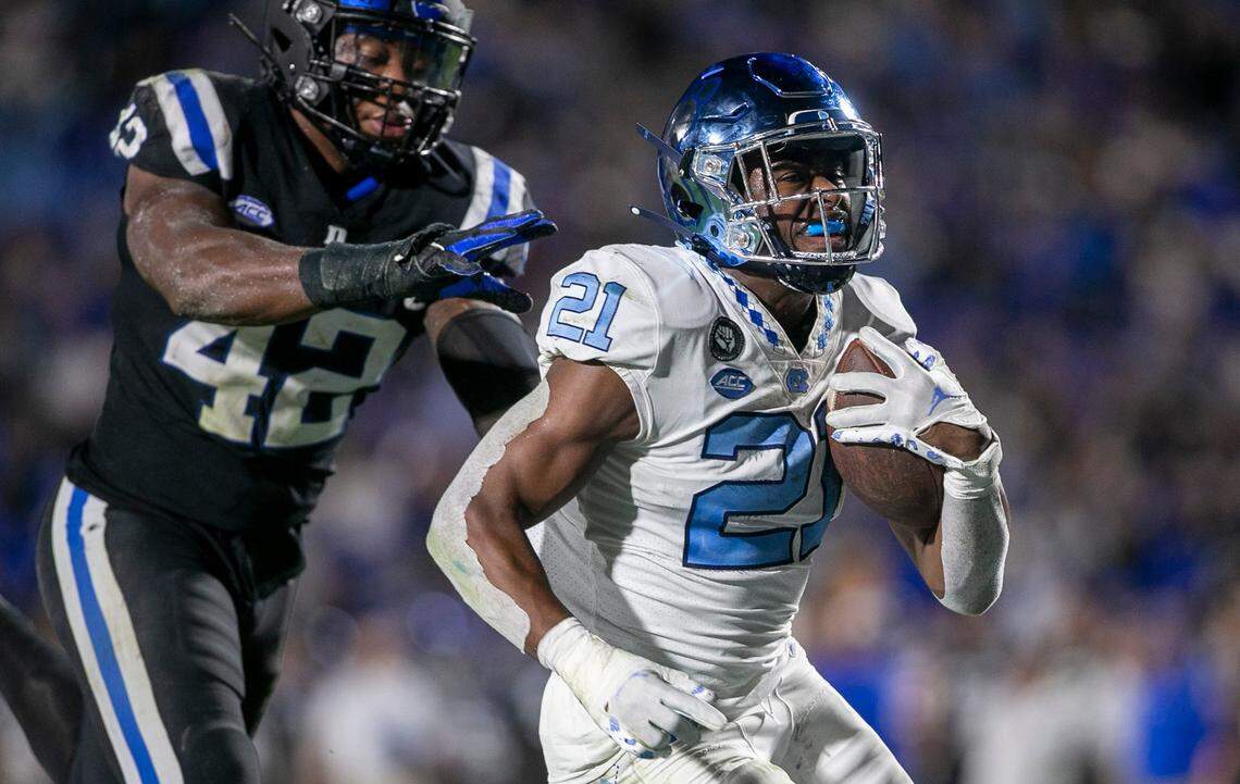 North Carolina’s Elijah Green (21) scores a touchdown on a 20-yard run in the third quarter against Duke on Saturday, October 15, 2022 at Wallace-Wade Stadium in Durham, N.C.