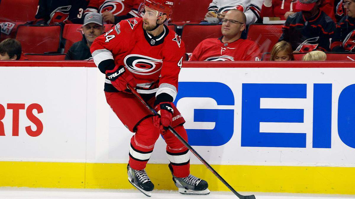 Carolina Hurricanes’ Calvin de Haan (44) looks to move the puck against the Columbus Blue Jackets during the first period of an NHL hockey game in Raleigh, N.C., Wednesday, Oct. 12, 2022. (AP Photo/Karl B DeBlaker)