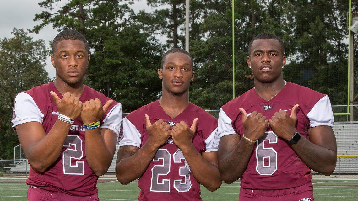 North Carolina Central’s, from left, Chauncey Caldwell, Jamal Currie-Elliott and Daeshawn Stephens, throw up the Bull City sign at ‘Meet the Eagles Day.’ The trio, who all played together at Hillside High, chose different routes out of high school, but all ended back up in Durham this season.