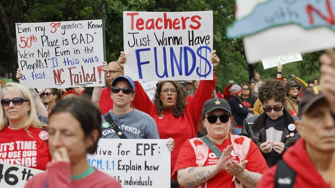 NC teachers raise their voices with creative signs at May Day rally