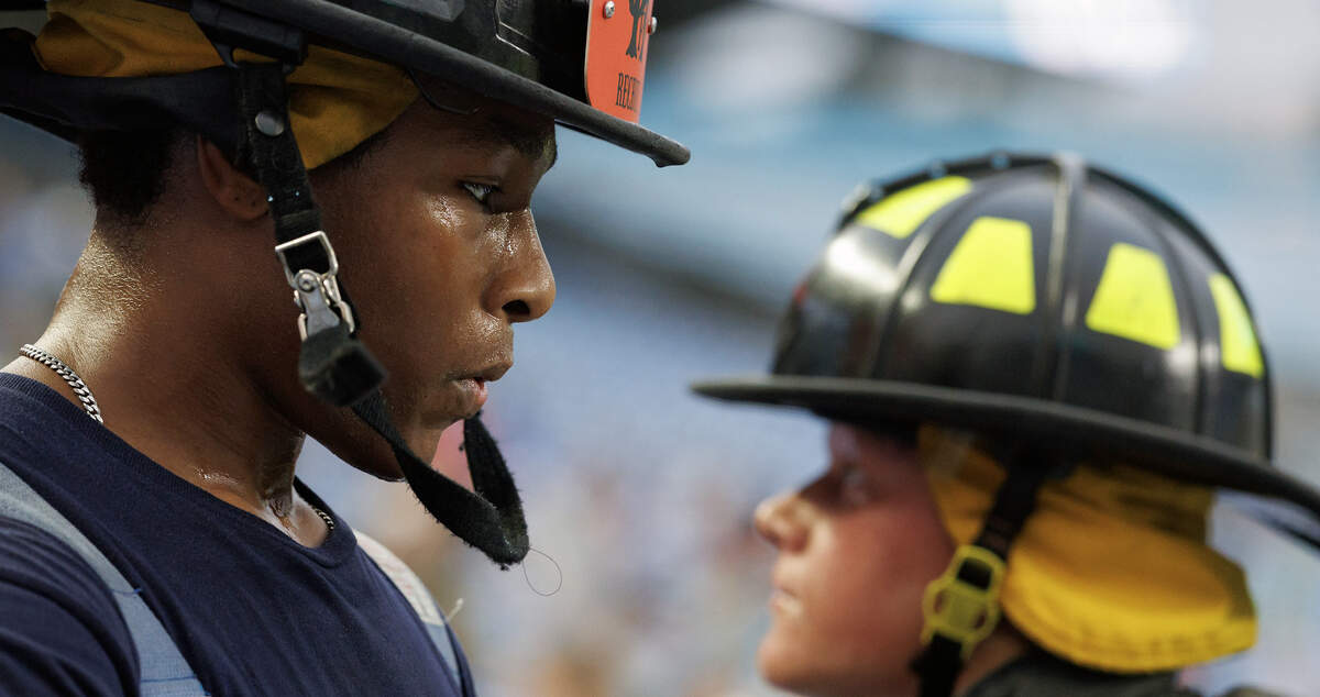 Sweat beads on the face of a participant while climbing the stairs of Kenan Memorial Stadium during an event in Chapel Hill, N.C. on Thursday, Sept. 11, 2025, to honor those who lost their lives during attacks of Sept. 11, 2001.