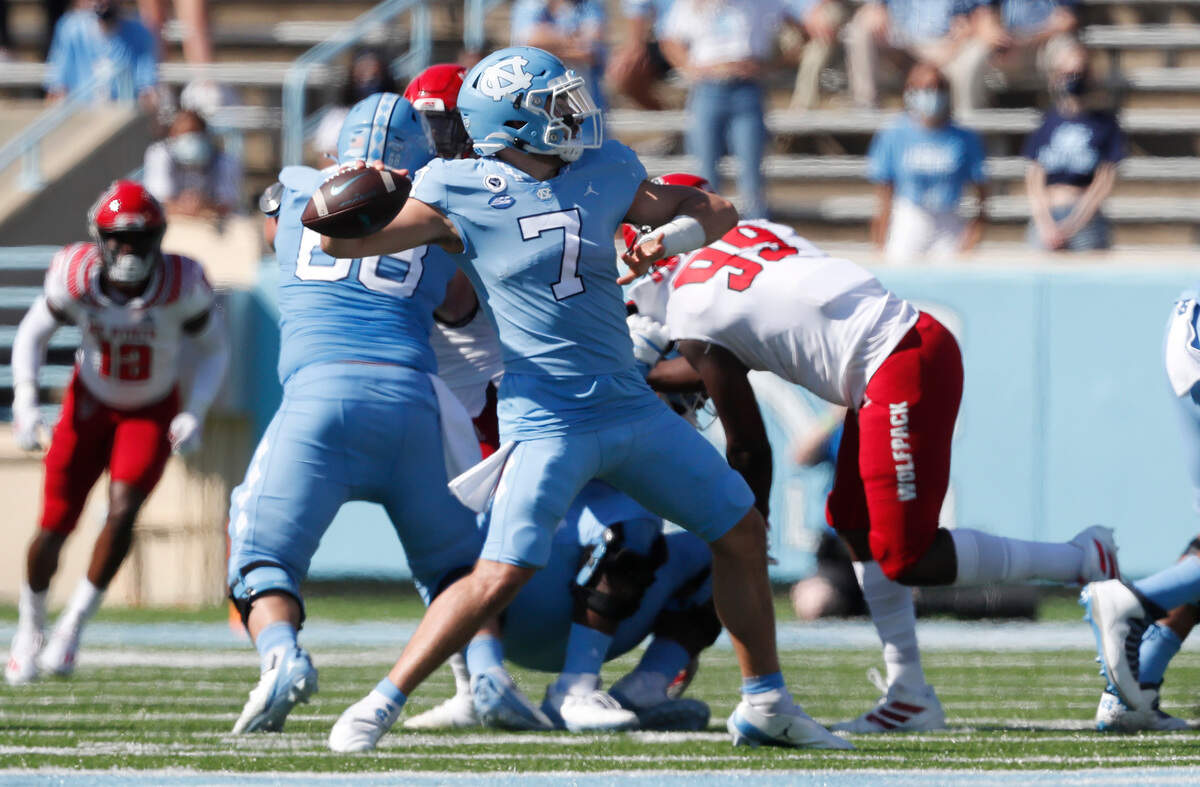 North Carolina quarterback Sam Howell (7) prepares to throw during the first half of N.C. State’s game against UNC at Kenan Stadium in Chapel Hill, N.C., Saturday, Oct. 24, 2020.