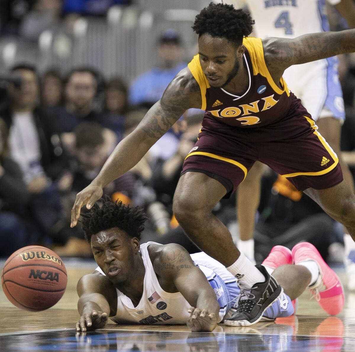 North Carolina’s Nassir Little (5) dives after a loose ball under Iona’s Asante Gist (3) during the second half on Friday, March 22, 2019 at Nationwide Arena in Columbus, Ohio. Little scored 19 points.