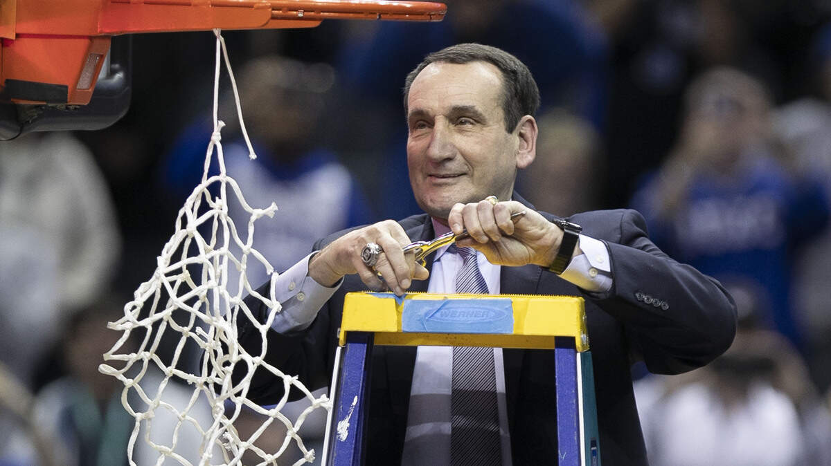Duke coach Mike Krzyzewski cuts down the net after Blue Devils clinched the ACC Tournament championship game with a 73-63 victory over Florida State on Saturday, March 16, 2019 at the Spectrum Center in Charlotte, N.C.