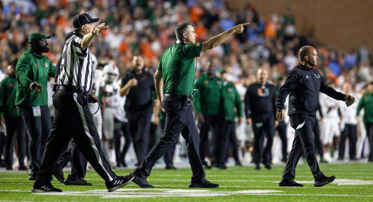 Miami coach Mario Cristobal questions a call by the officials in the second quarter against North Carolina on Saturday, October 14, 2023 at Kenan Stadium in Chapel Hill, N.C.