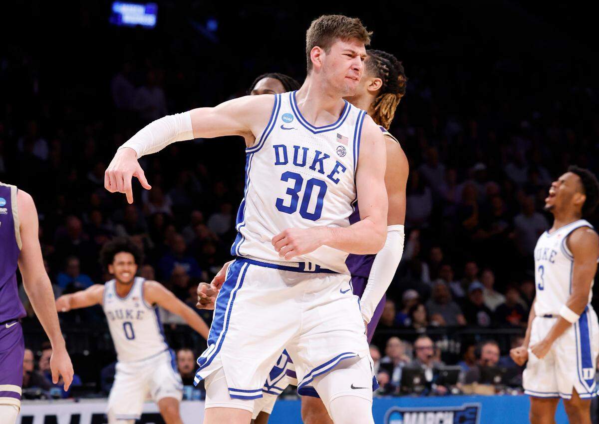 Duke’s Kyle Filipowski (30) celebrates after making the basket while being fouled during the second half of Duke’s 93-55 victory over James Madison in the second round of the NCAA Tournament at the Barclays Center in Brooklyn, N.Y., Sunday, March 24, 2024.