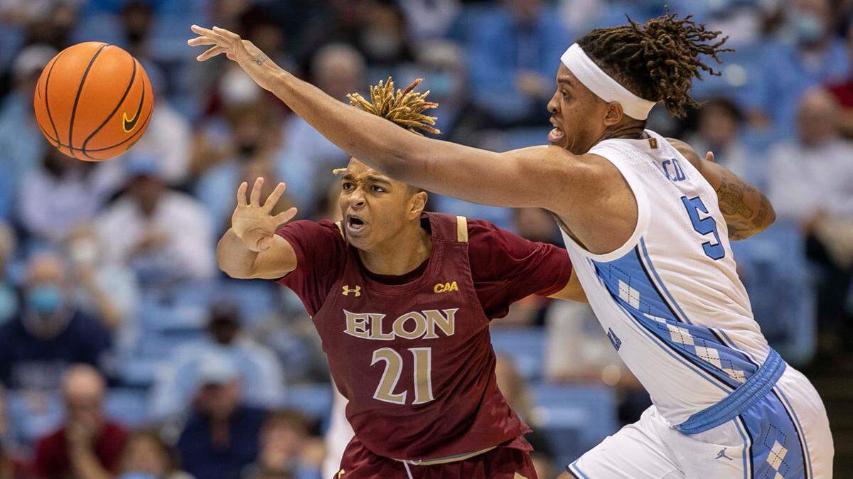 North Carolina’s Armando Bacot (5) makes a steal from Elon’s Michael Graham (21) during the second half on Saturday, December 11, 2021 at the Smith Center in Chapel Hill, N.C.
