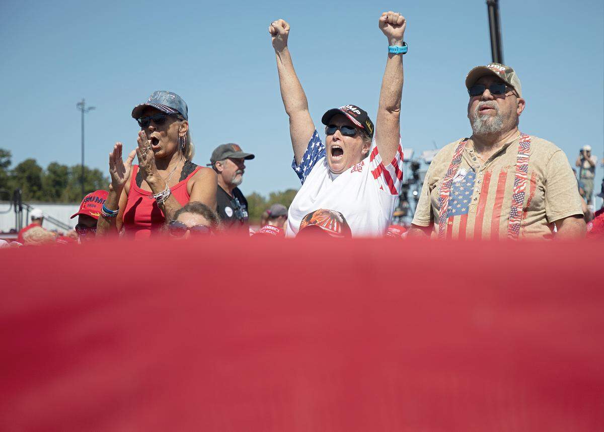 People cheer at the start of a rally held in support of former President and current Republican candidate for president Donald Trump in Wilmington, N.C. on Saturday, Sept. 21, 2024.