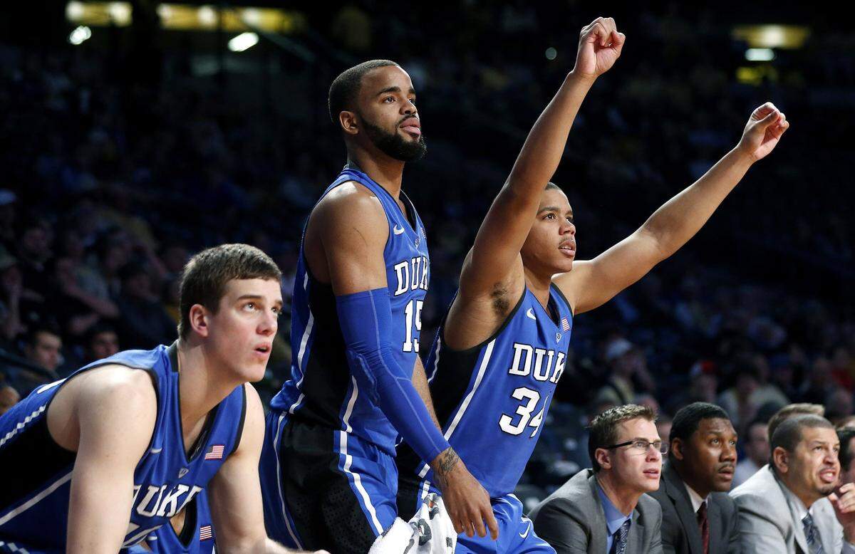 Duke players from left to right Marshall Plumlee (40), Josh Hairston (15) and Andre Dawkins (34) react on the bench after a basket late in the second half of an NCAA college basketball game against Georgia Tech, Tuesday, Feb. 18, 2014, in Atlanta. Duke won 68-51. (AP Photo/John Bazemore)