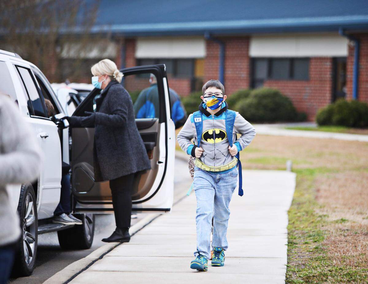 Princeton Elementary School students arrive back at school for in-person classes Monday morning, Feb. 1, 2021, in Princeton, NC. Despite lobbying from some teachers to stay with remote instruction, Johnston students across all grade levels showed up Monday for their first day of in-person classes since Dec. 14.