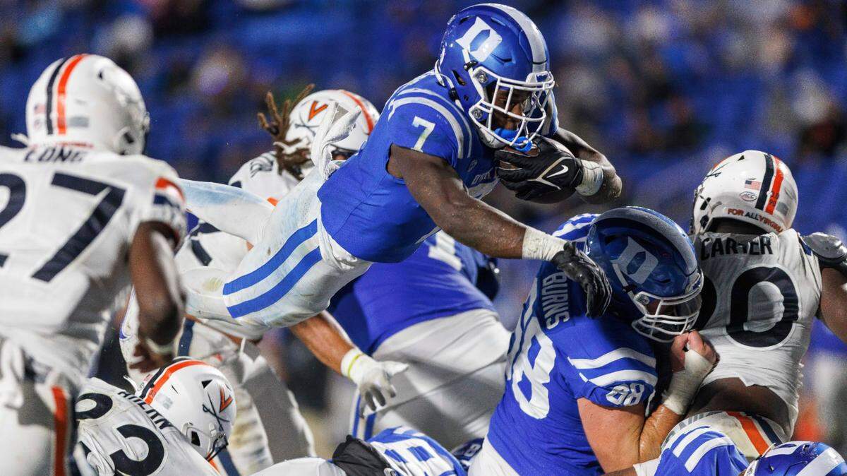 Duke’s Jordan Waters (7) leaps for a touchdown during the first half of the team’s NCAA college football game against Virginia in Durham, N.C., Saturday, Oct. 1, 2022.