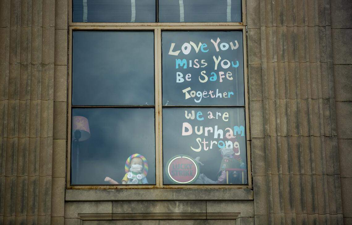 An apartment window on Main St. displays a positive message to those struggling under the coronavirus pandemic on Friday, May 15, 2020, in Durham, N.C.