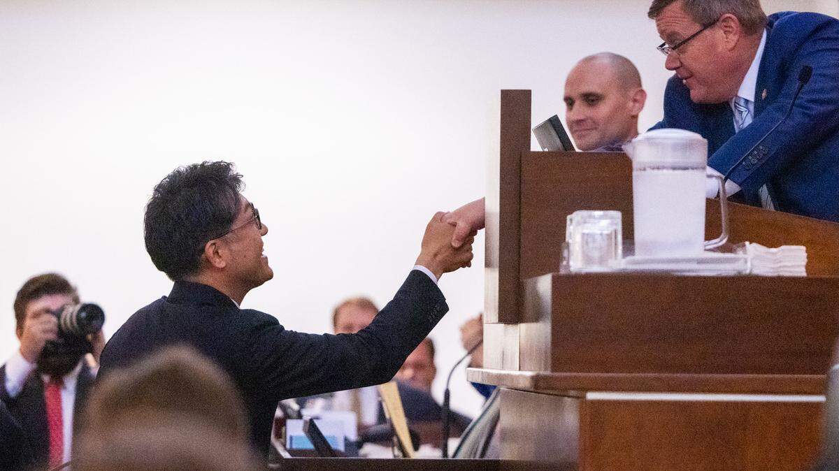 Toyota’s new CEO Koji Sato, left, shakes hands with House Speaker Tim Moore on the House Floor during a tour of the General Assembly Thursday, June 22, 2023 at the North Carolina State Legislative Building in Raleigh.