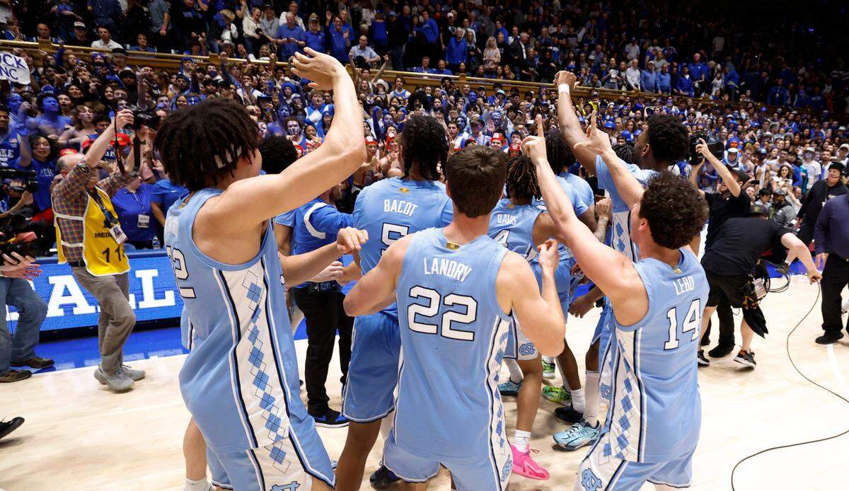 North Carolina players motion to the Cameron Crazies after UNC’s 84-79 victory over Duke at Cameron Indoor Stadium in Durham, N.C., Saturday, March 9, 2024.