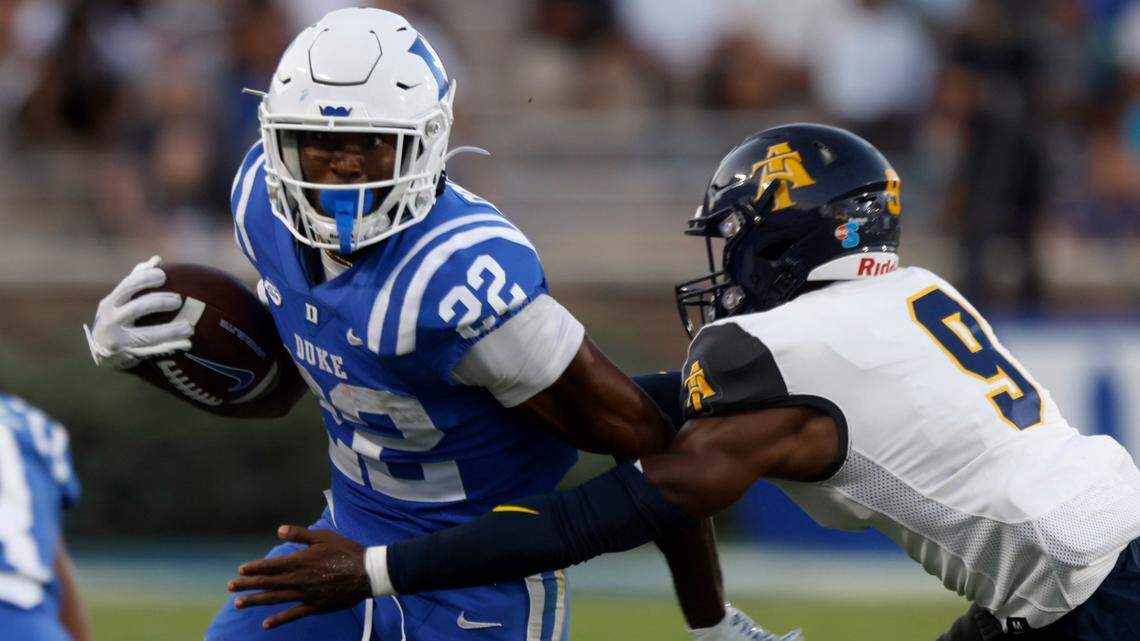 Duke Blue Devils running back Jaylen Coleman runs past North Carolina A&T Aggies defensive back Janaz Sumpter during the first half of Dukes game against North Carolina A&T at Wallace Wade Stadium in Durham, N.C. on Saturday, Sept. 17, 2022.