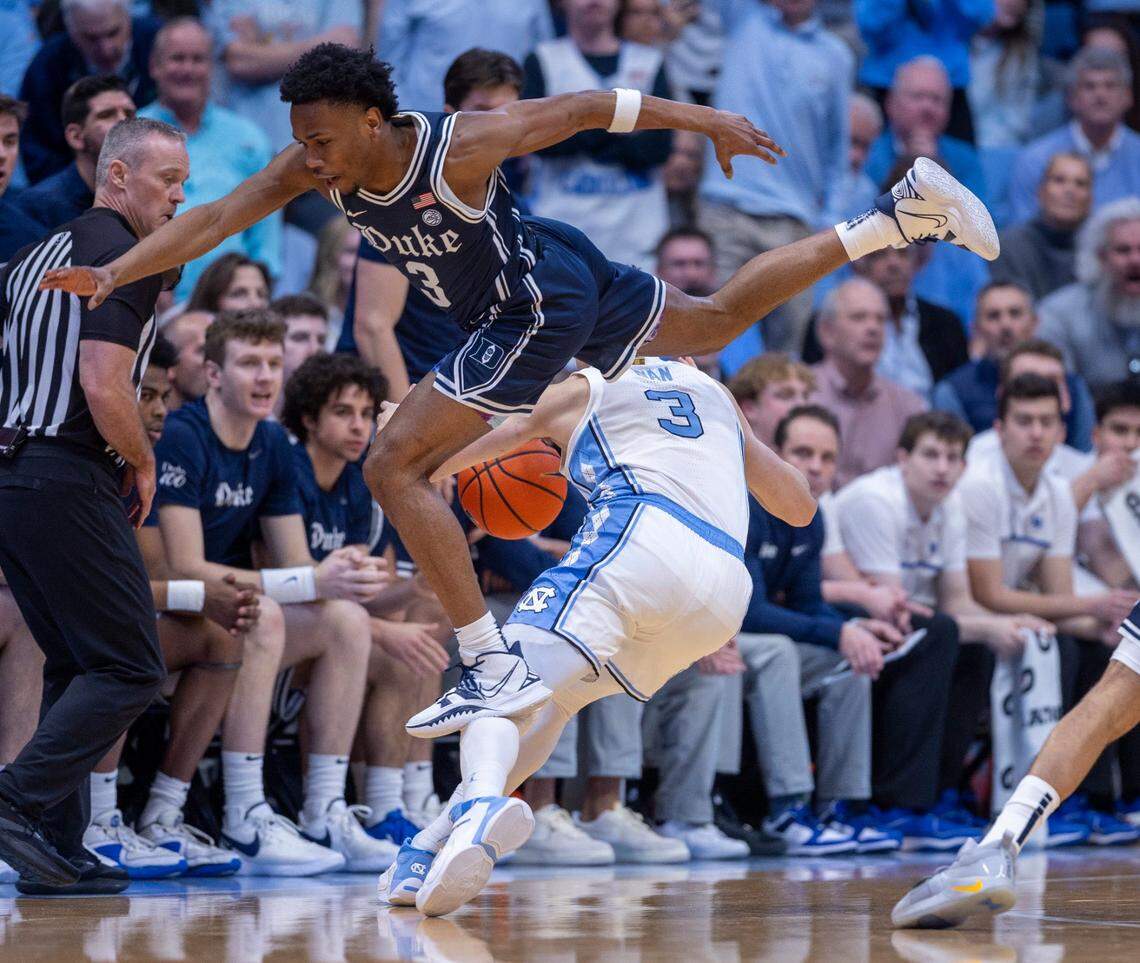 Duke’s Jeremy Roach (3) hurdles over North Carolina’s Cormac Ryan (3) in the first half on Saturday, February, 3, 2024 at the Dean E. Smith Center in Chapel Hill, N.C.