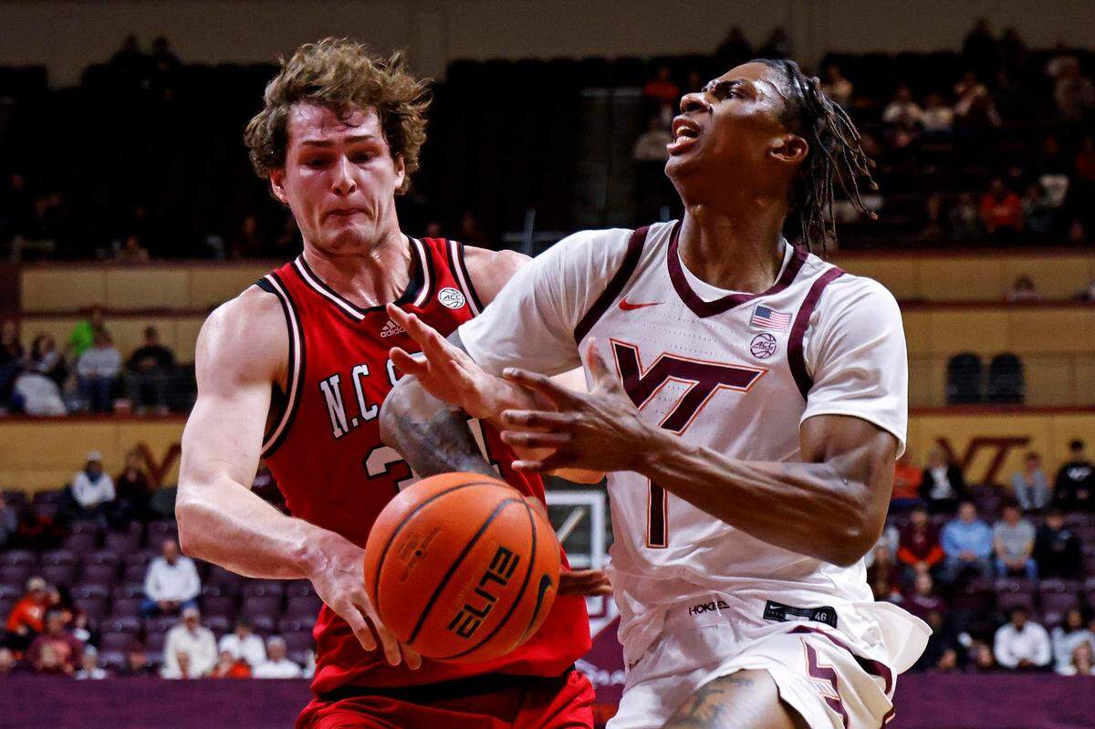 North Carolina State Wolfpack forward Ben Middlebrooks (34) knocks the ball away from Virginia Tech Hokies forward Tobi Lawal (1) during the first half at Cassell Coliseum.