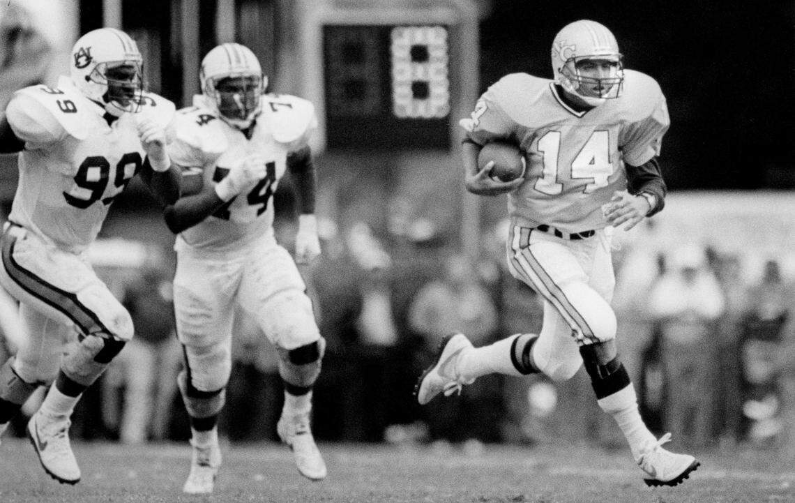 North Carolina quarterback Mark Maye (14) runs the ball against Auburn on October 3, 1987 at Kenan Stadium in Chapel Hill, N.C.