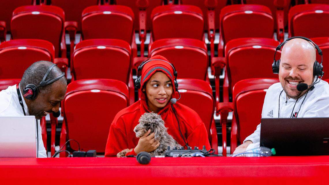 N.C. State guard Zamareya Jones, center, holds her dog Buzz during a radio interview with Ernie Myers and Andrew Sanders following the Wolfpack’s 68-61 win over Ole Miss on Dec. 5, 2024, during the ACC-SEC Challenge.