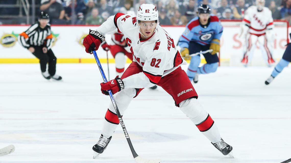 Dec 4, 2023; Winnipeg, Manitoba, CAN; Carolina Hurricanes forward Jesperi Kotkaniemi (82) skates into the Winnipeg Jets zone during the first period at Canada Life Centre. Mandatory Credit: Terrence Lee-USA TODAY Sports
