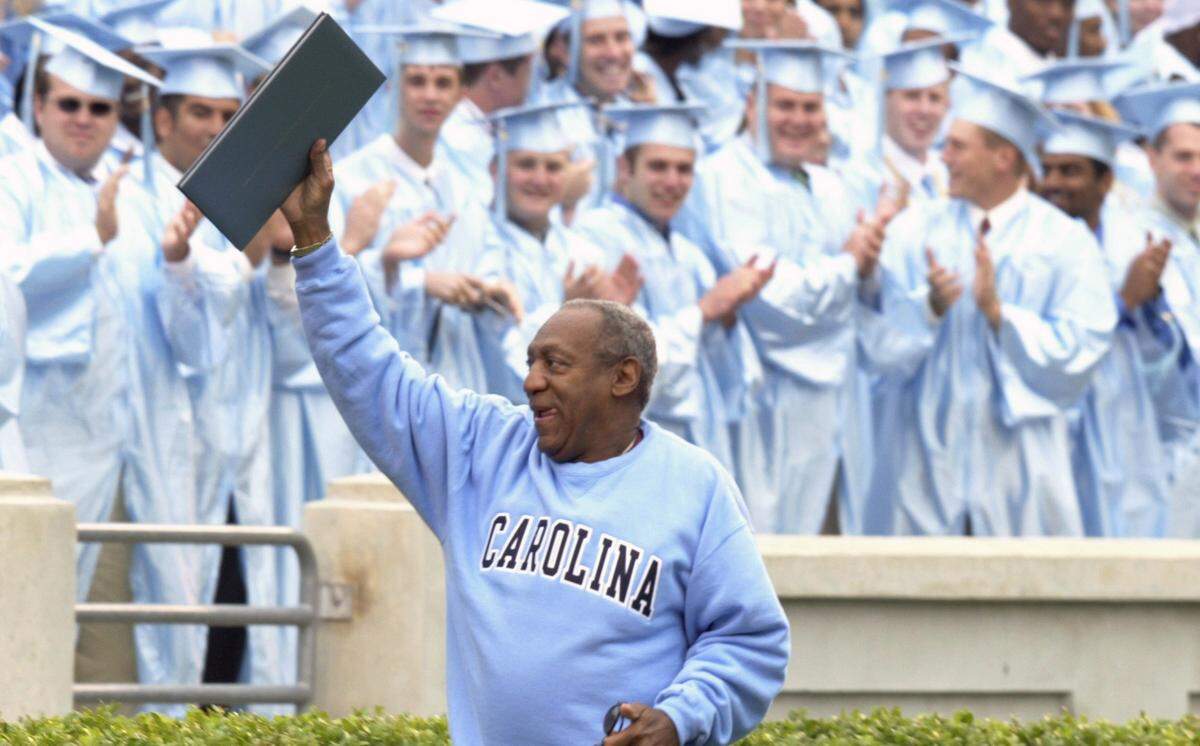 Bill Cosby leaves the field after delivering the commencement address at UNC's 2003 Commencement exercises at Kenan Stadium.