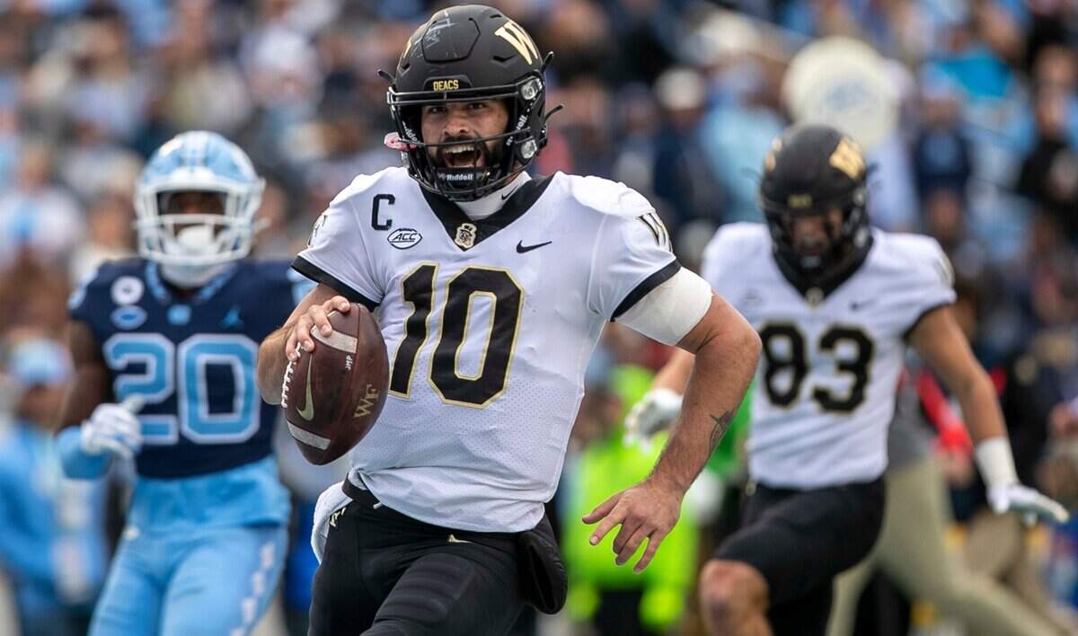 Wake Forest quarterback Sam Hartman (10) scores on a 21-yards run for a touchdown in the third quarter against North Carolina on Saturday, November 6, 2021 at Kenan Stadium in Chapel Hill, N.C.