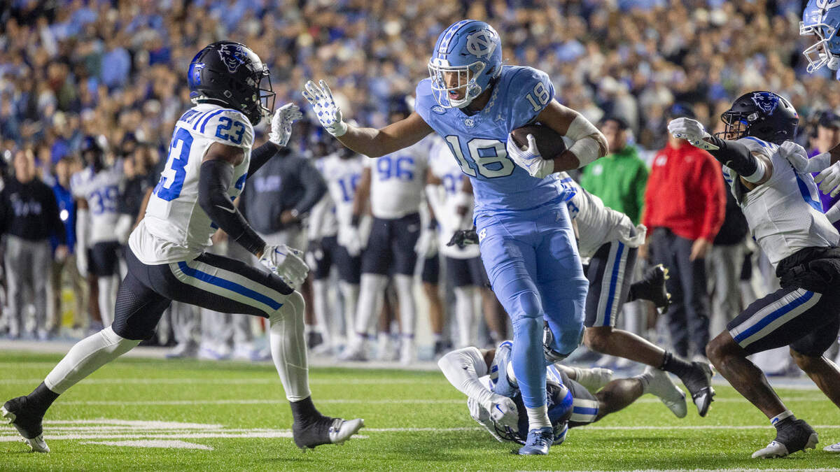 North Carolina’s Bryson Nesbit picks up eight yards after a pass from quarterback Drake Maye in the first quarter against Duke on Saturday, Nov. 11, 2023 at Kenan Stadium in Chapel Hill, N.C.