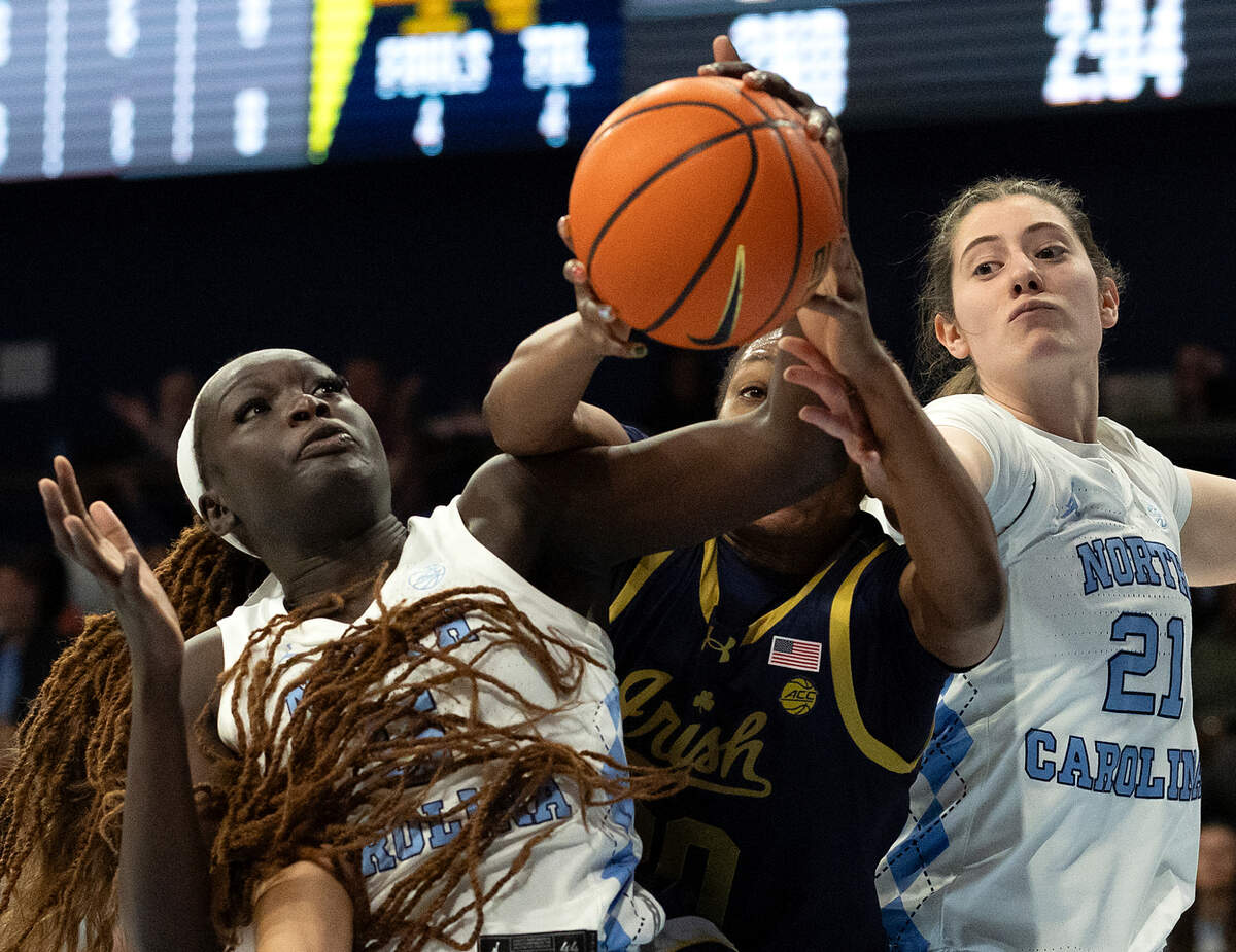 North Carolina’s Maria Gakdeng and Ciera Toomey battle for a rebound with Notre Dame’s Liatu King during the first half of the Tar Heels’ 76-66 loss on Sunday, Jan. 5, 2025, at Carmichael Arena in Chapel Hill, N.C.