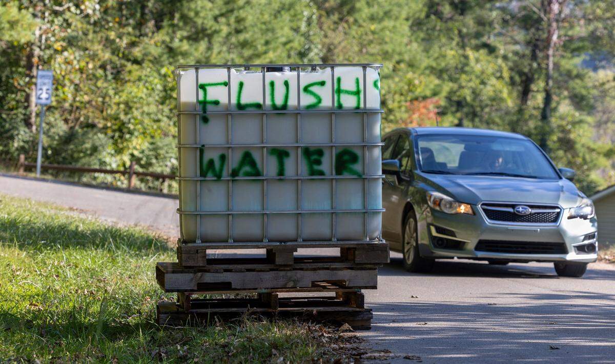 A pallet with non-potable water, for flushing toilets, is positioned on Woodburn Drive, on Tuesday, October 8, 2024 in Swannanoa, N.C. for residents to use after Hurricane Helene disabled water service to the town.