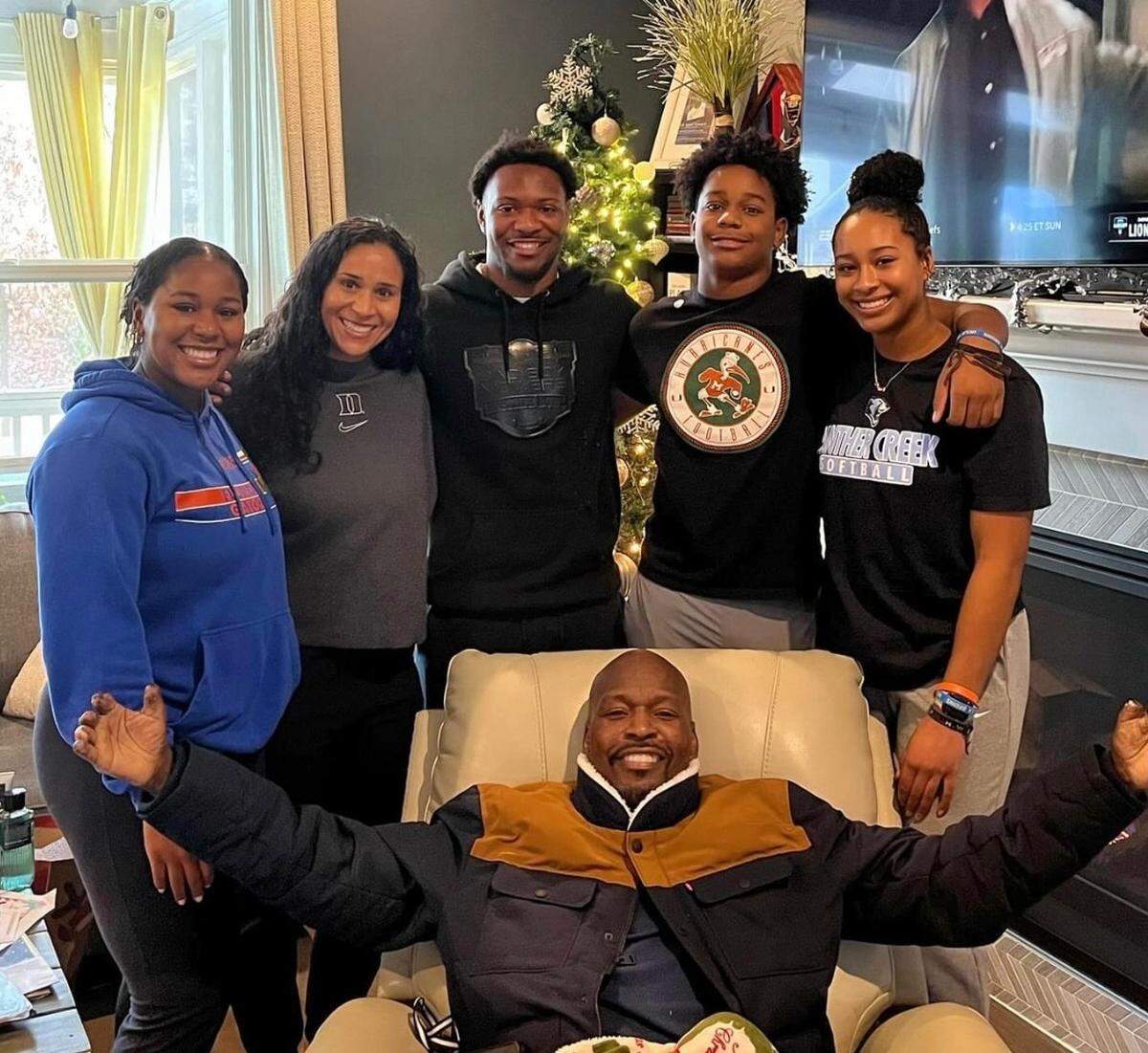 Layla Lamar, Marissa Young, Braylon Lamar, Kayden Lamar and Jolyna Lamar surround James Lamar at home in December 2023.