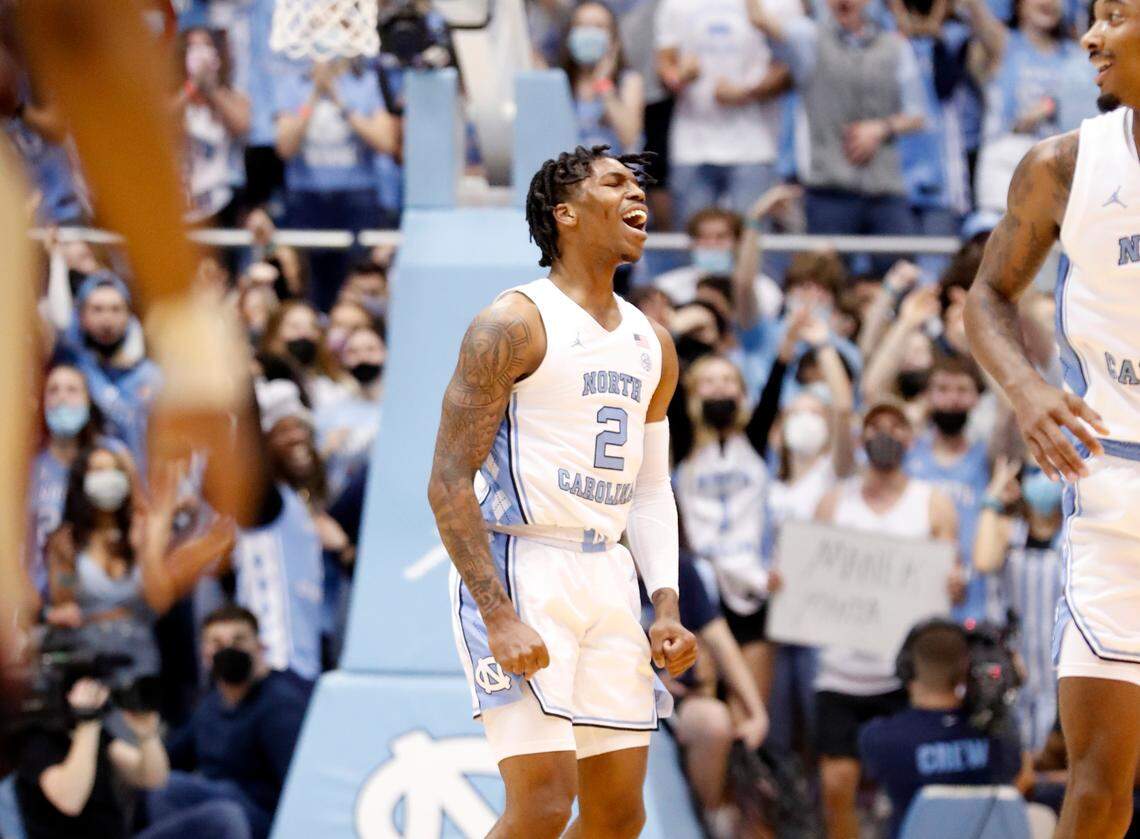 North Carolina’s Caleb Love (2) celebrates hitting a three-pointer during the first half of UNC’s game against FSU at the Smith Center in Chapel Hill, N.C., Saturday, Feb. 12, 2022.