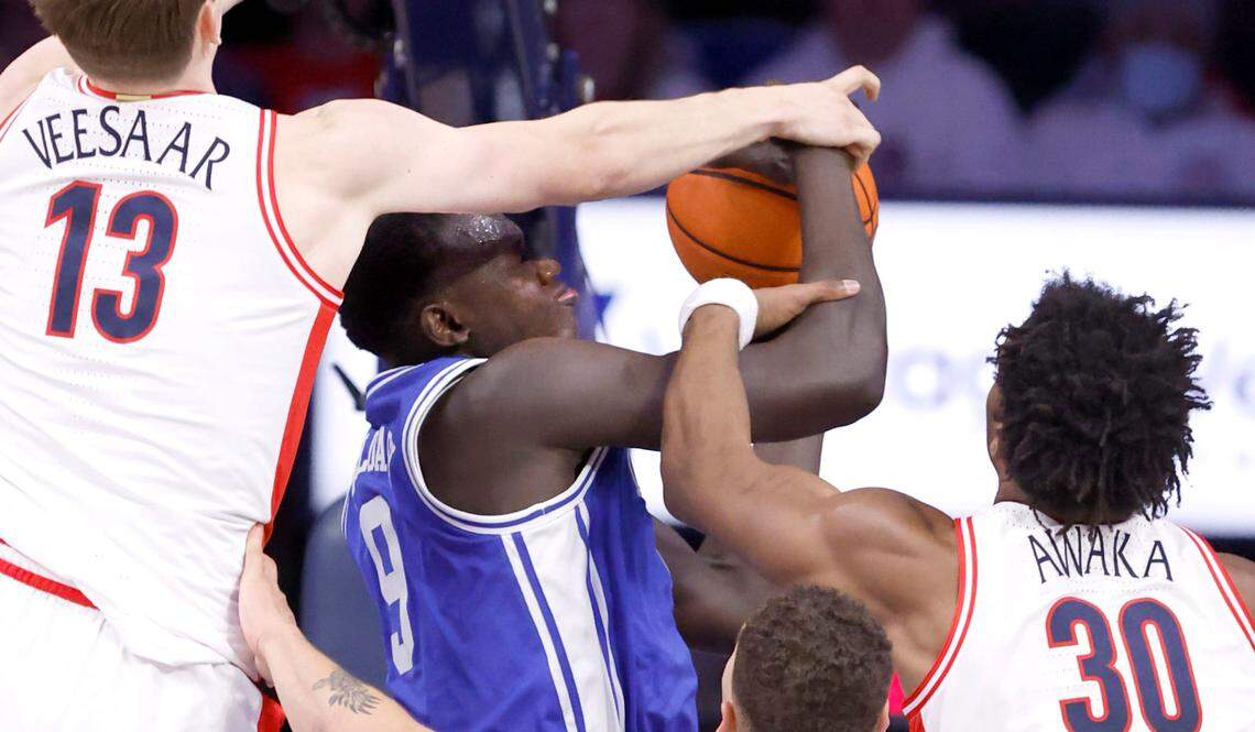 Duke’s Khaman Maluach (9) pulls in the rebound from Arizona’s Henri Veesaar (13), left, and Tobe Awaka (30) during the second half of Duke’s 69-55 victory over Arizona at the McKale Memorial Center in Tucson, Ariz., Friday, Nov. 22, 2024.