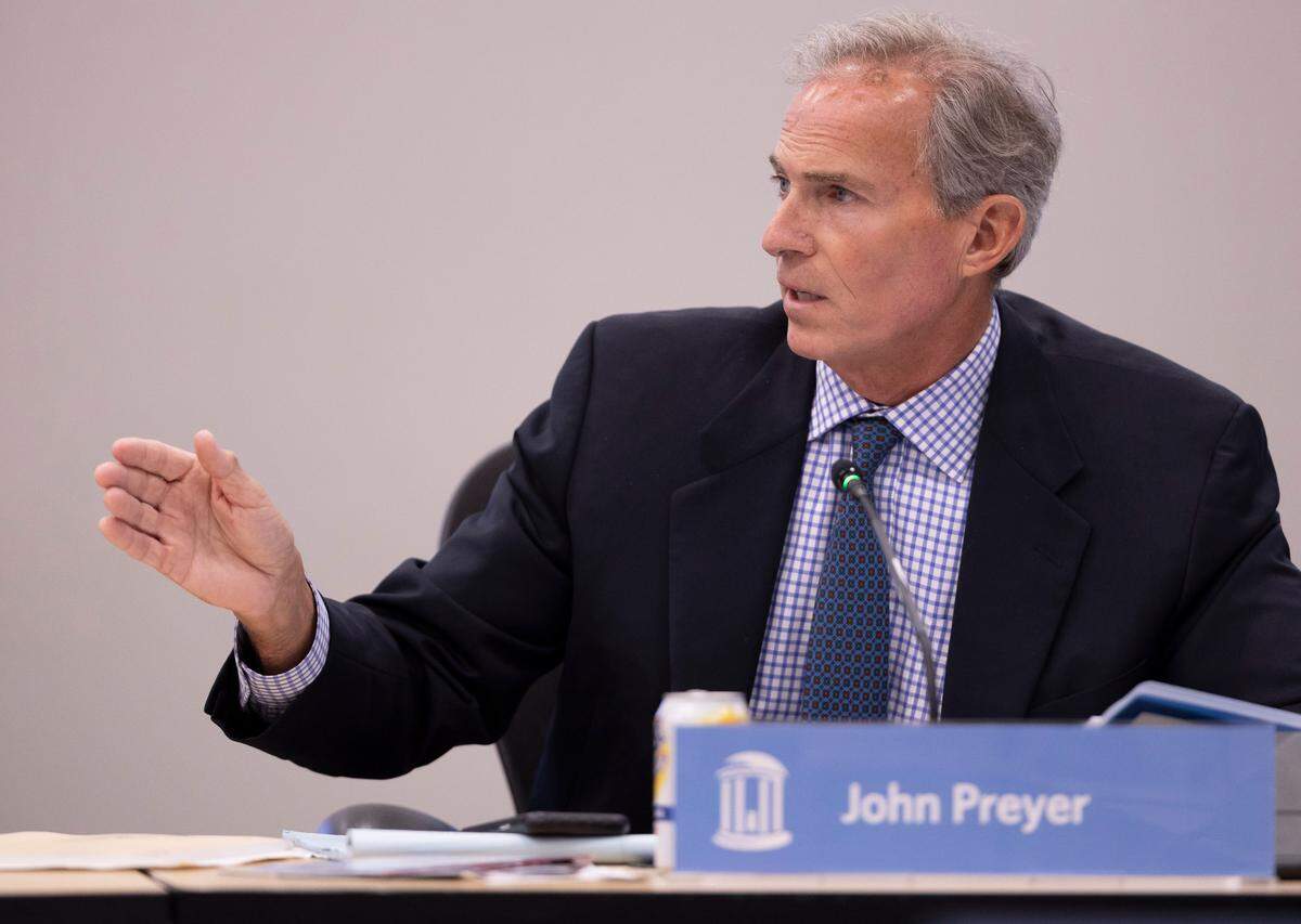 UNC Board of Trustees chair John Preyer questions Veronica Mora Flaspoehler, president of Carolina Alumni, during a meeting on Wednesday, May 21, 2025 in Chapel Hill, N.C.