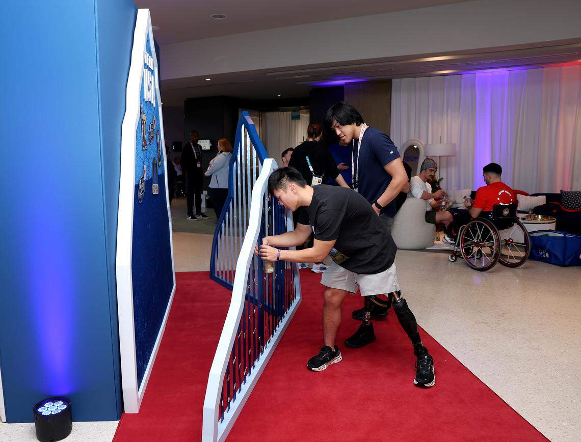 Para Sled Hockey athletes Brett Bolton and Kayden Beasley check out the pin trade area during the Team United States Welcome Experience At Milan-Cortina 2026 Paralympics on Feb. 28, 2026 in Venice, Italy.