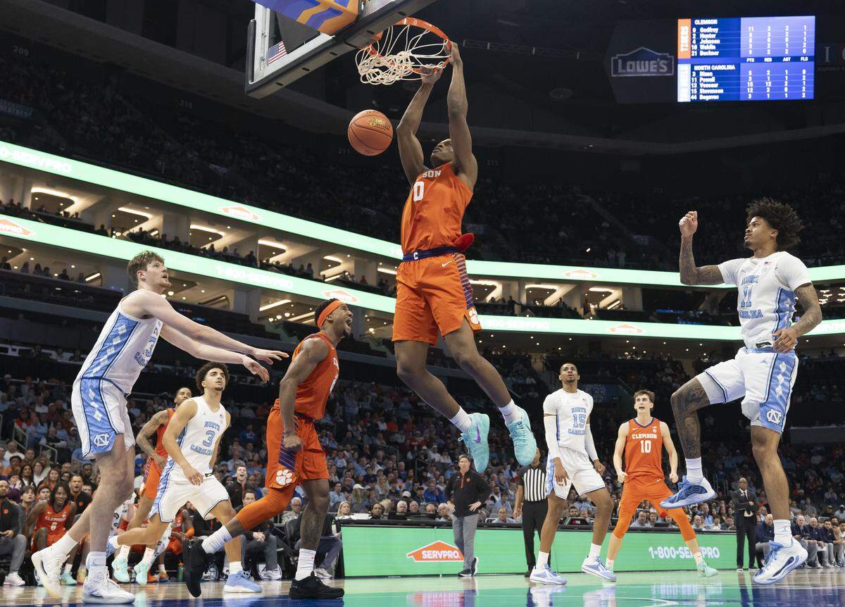 Clemson forward R J Godfrey (0) breaks to the basket for a dunk in the second half against North Carolina on Thursday, March 12, 2026, during the quarterfinals of the ACC Tournament at Spectrum Center in Charlotte, N.C. Godfrey scored 13 points in the Tigers’ 80-79 victory.