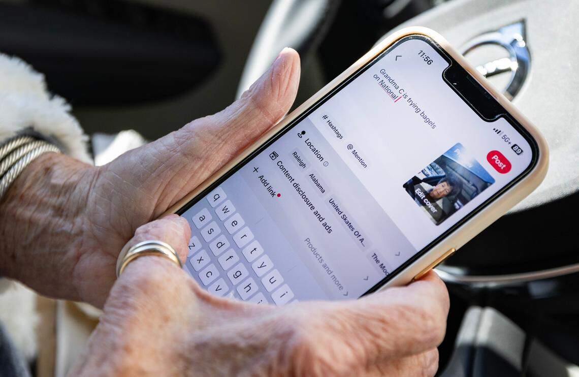 Carol Chapman, known as Grandma C, posts her TikTok after tasting a bagel from New York Bagel and Deli in North Raleigh, Wednesday, Jan. 15, 2025.